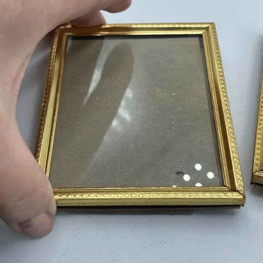 Set of 2 vintage gold colored picture frames 3 X 4”.